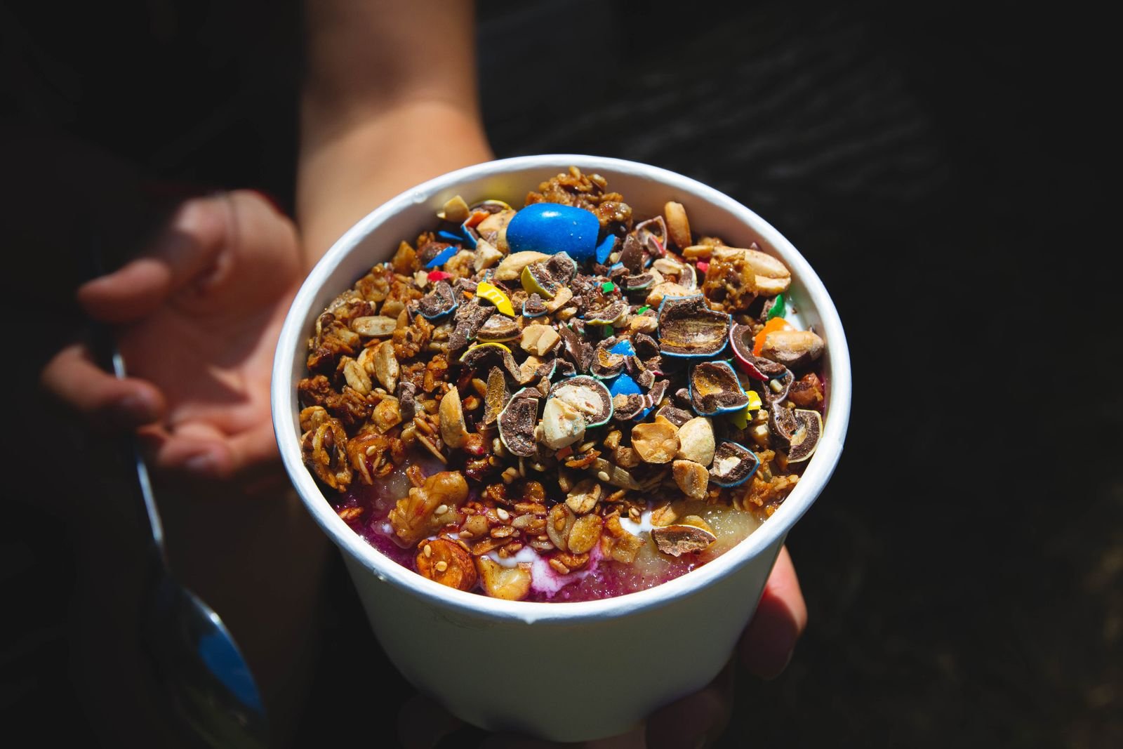 Açaí bowl topped with granola and fruit
