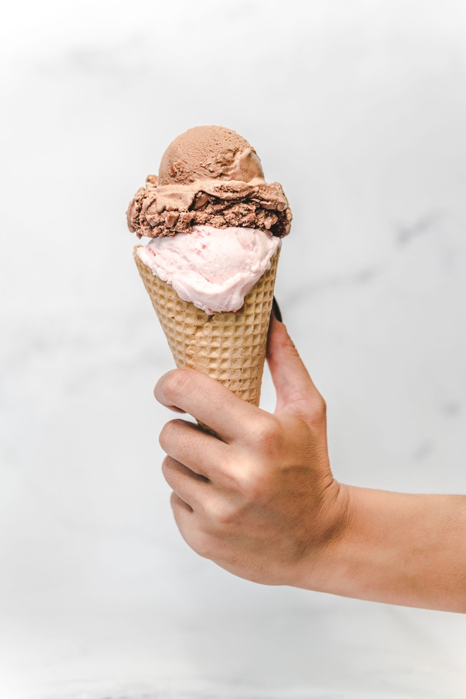 Hand holding an ice cream cone